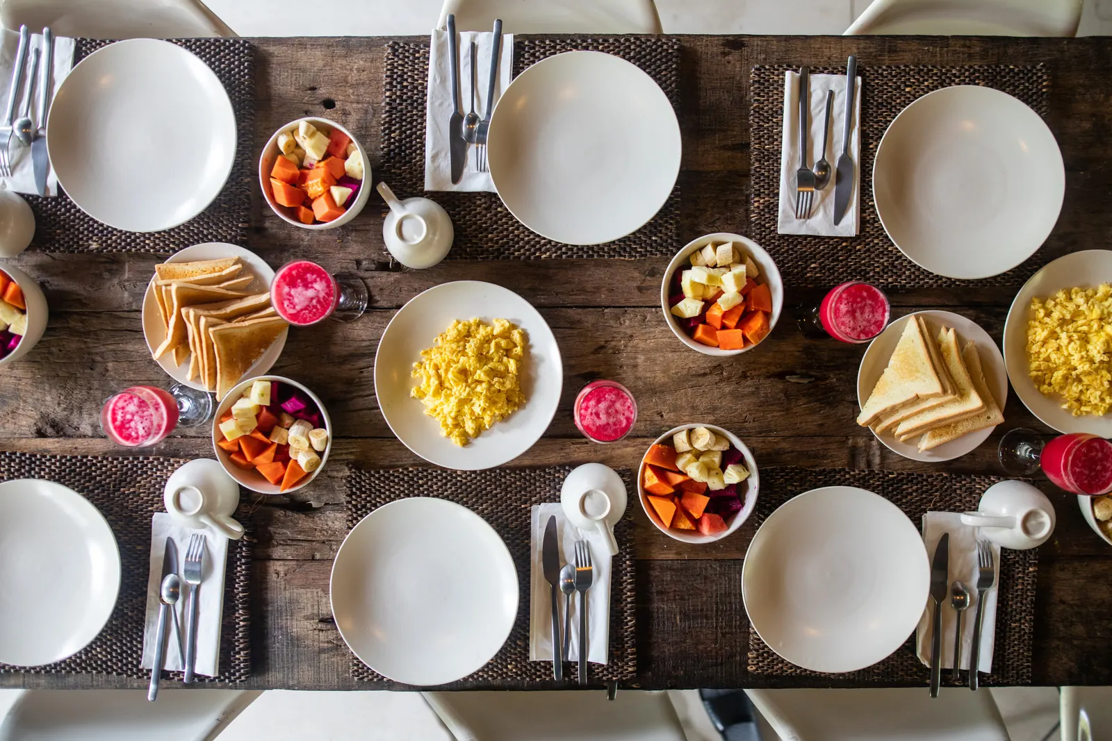 Breakfast table with eggs, fruit and toast